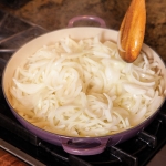 sliced onions in a skillet