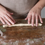 rolling bread dough into a rope